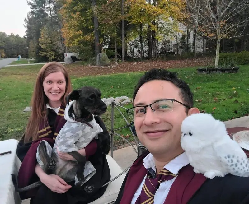 Woman, Dog, and Man with stuffed Owl dressed as Harry Potter Characters